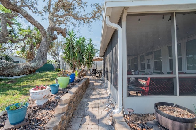 view of terrace featuring a sunroom