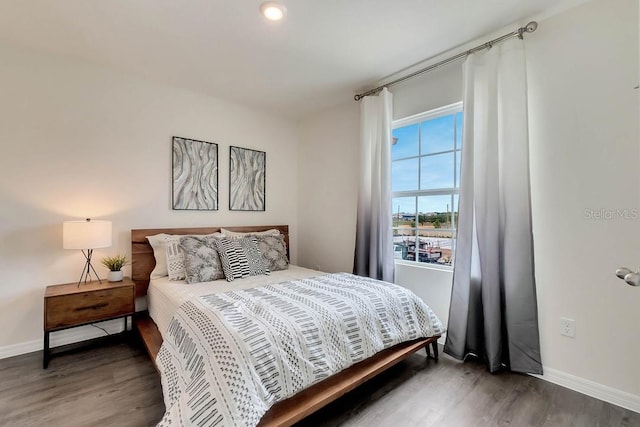 bedroom featuring dark wood-type flooring