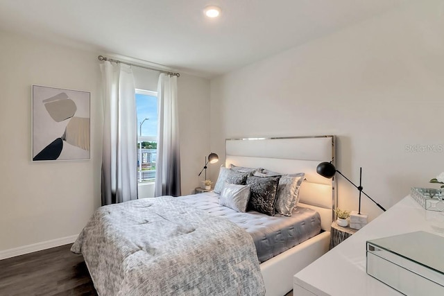 bedroom featuring dark hardwood / wood-style flooring