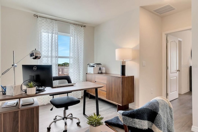 office space featuring light hardwood / wood-style floors