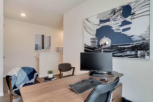 home office with hardwood / wood-style floors