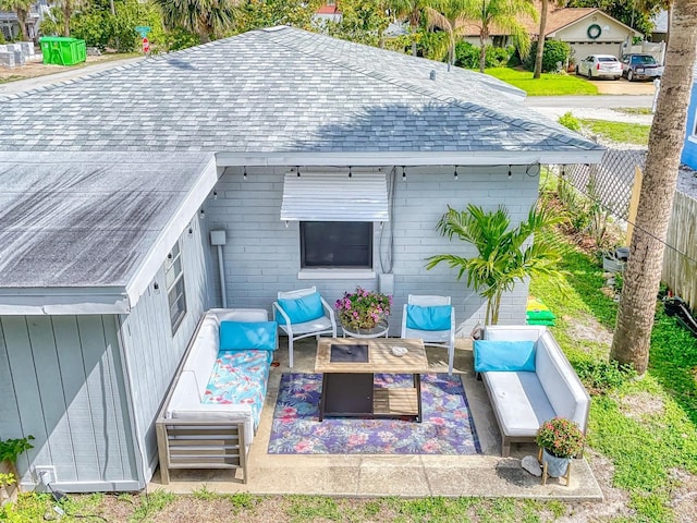 exterior space featuring an outdoor hangout area and a patio