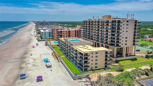 aerial view featuring a view of the beach and a water view