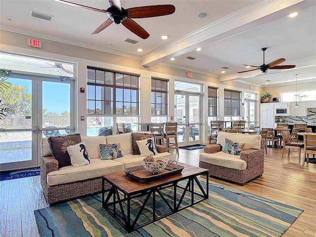 1 Riverwalk Dr Unit 302, New Smyrna Beach, FL 32169 - living area featuring crown molding, visible vents, french doors, and ceiling fan