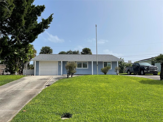 single story home with a front yard and a garage