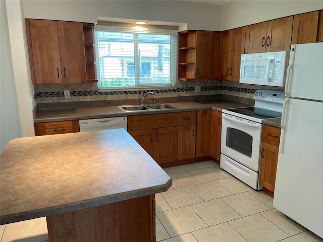 kitchen with backsplash, light tile floors, white appliances, and sink