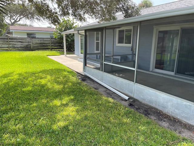 view of home's exterior with a yard