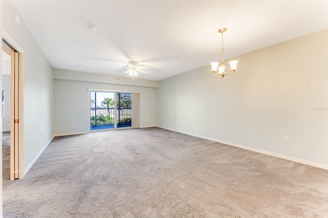 unfurnished room featuring ceiling fan with notable chandelier and carpet flooring