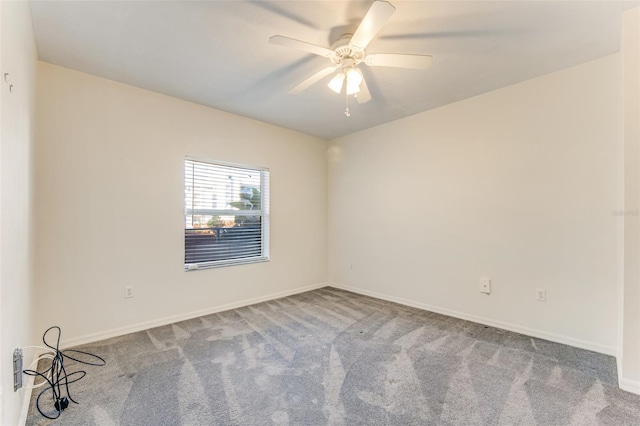 empty room featuring carpet and ceiling fan