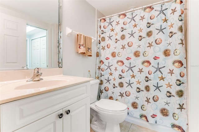 bathroom with tile patterned flooring, vanity, a shower with curtain, and toilet