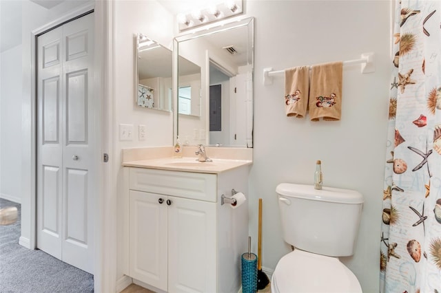 bathroom featuring vanity and toilet