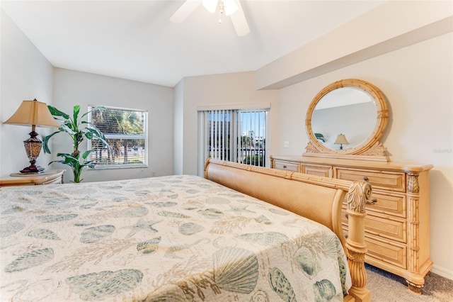 bedroom with multiple windows, ceiling fan, and carpet flooring