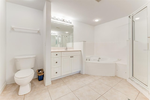 full bathroom with tile patterned flooring, vanity, separate shower and tub, and toilet