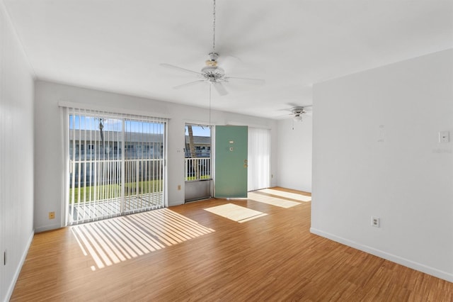 spare room featuring ceiling fan and light wood-type flooring