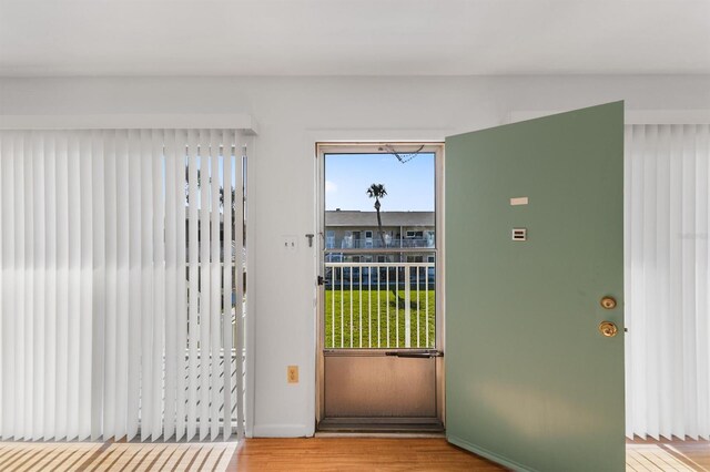 doorway with light hardwood / wood-style flooring