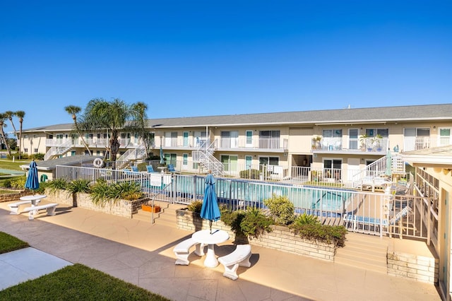 view of property with a community pool