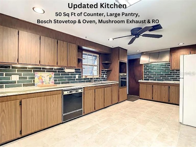 kitchen featuring range hood, black dishwasher, backsplash, white refrigerator, and ceiling fan