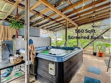 view of patio / terrace with a hot tub