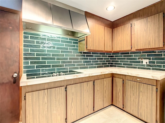 kitchen featuring black electric cooktop, range hood, and decorative backsplash