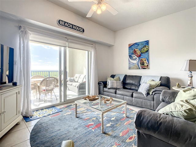 living room featuring light tile patterned floors and ceiling fan