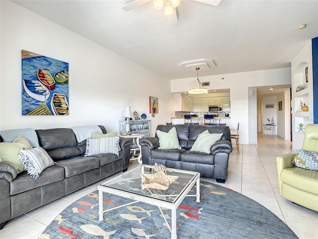 tiled living room with ceiling fan