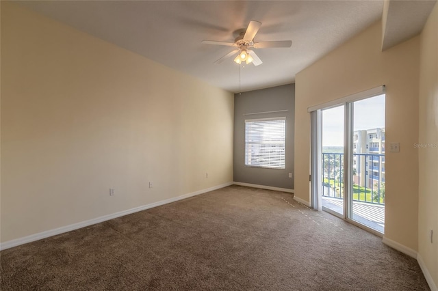 carpeted spare room with ceiling fan