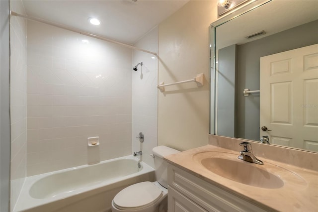 full bathroom with toilet, tiled shower / bath combo, and vanity