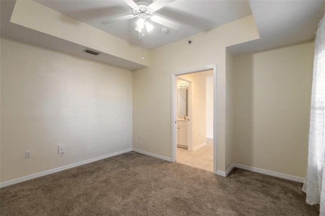 5300 S Atlantic Ave Unit 8502, New Smyrna Beach, FL 32169 - spare room featuring ceiling fan, baseboards, light colored carpet, and visible vents
