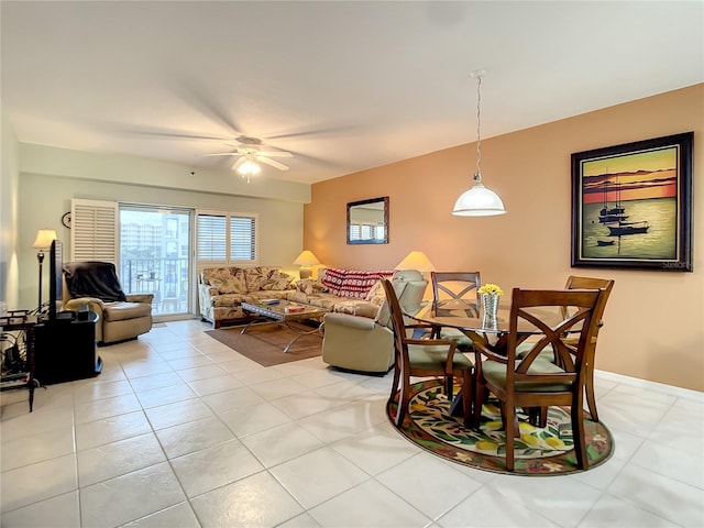 dining room with light tile patterned floors and ceiling fan