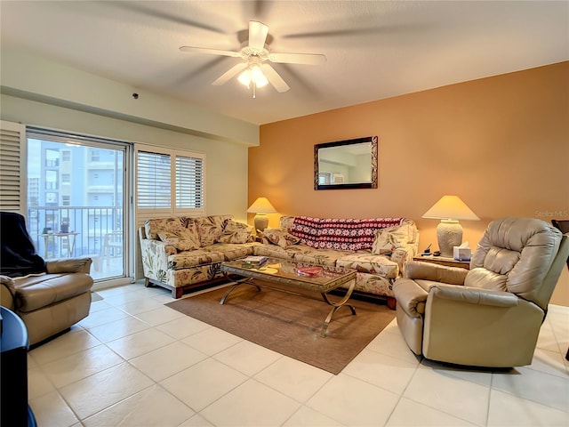 living room with ceiling fan and light tile patterned floors