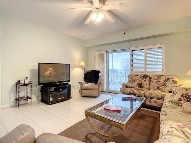 living room with light tile patterned floors and ceiling fan