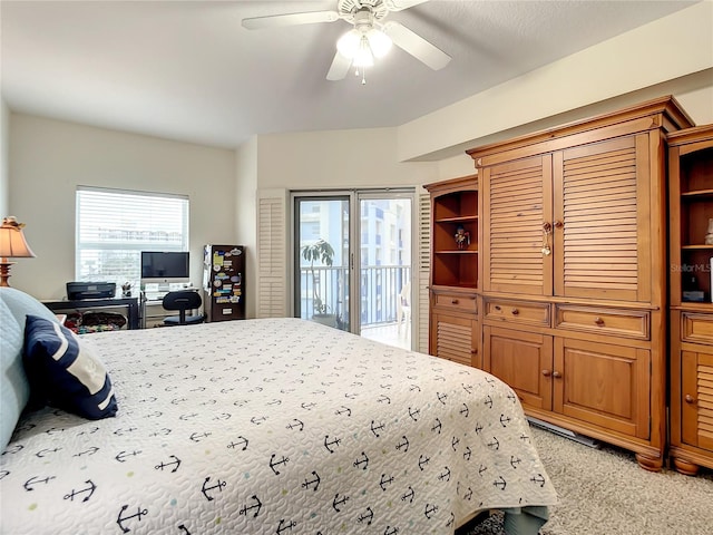 carpeted bedroom featuring access to exterior and ceiling fan