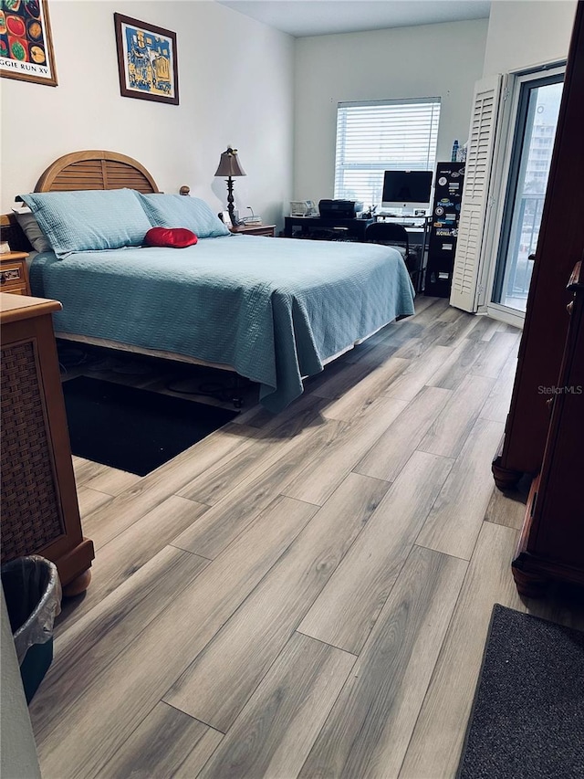 bedroom featuring light wood-type flooring