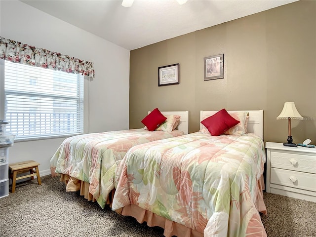 bedroom featuring ceiling fan and carpet flooring