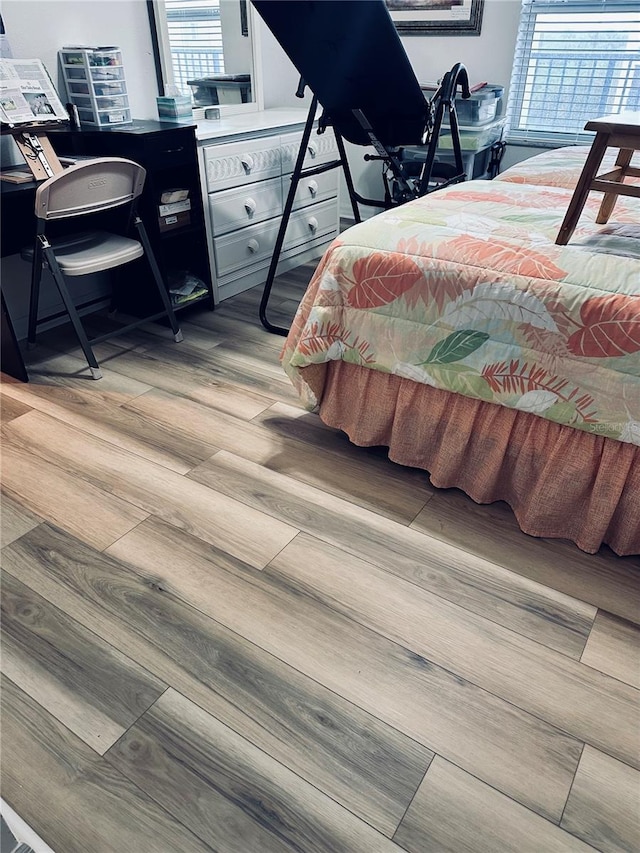 bedroom with light hardwood / wood-style flooring