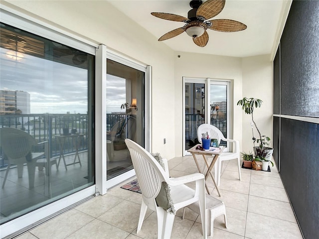 balcony featuring ceiling fan and a patio area