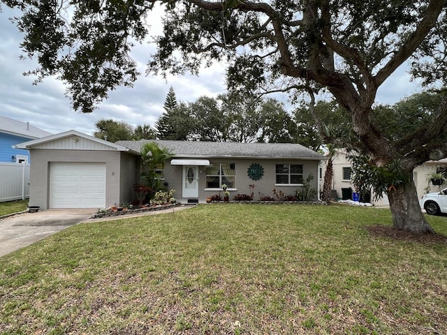 single story home with a front lawn and a garage