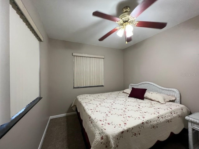 bedroom with ceiling fan and carpet