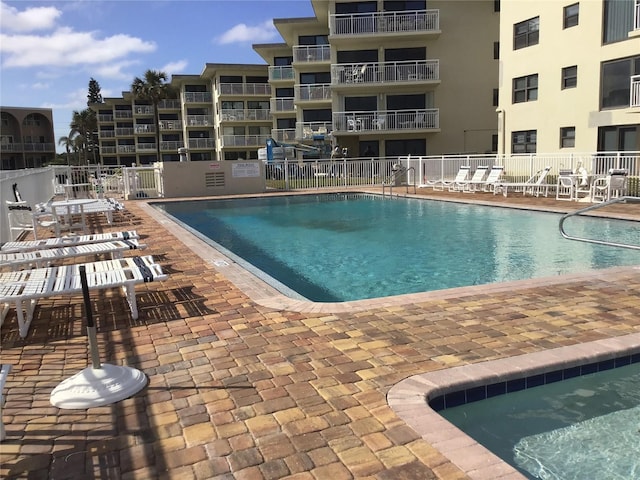 community pool featuring fence