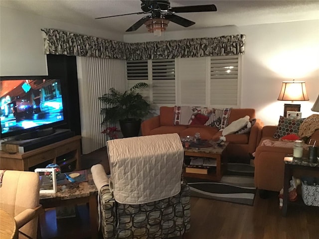 living room with wood-type flooring and ceiling fan