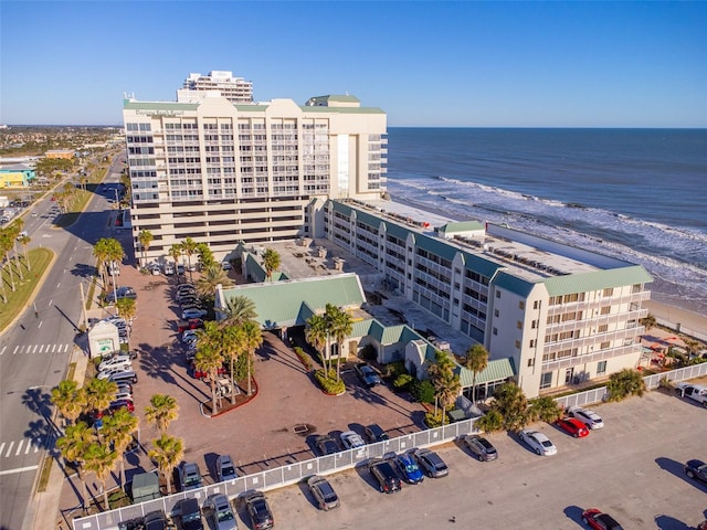 birds eye view of property featuring a view of the beach and a water view