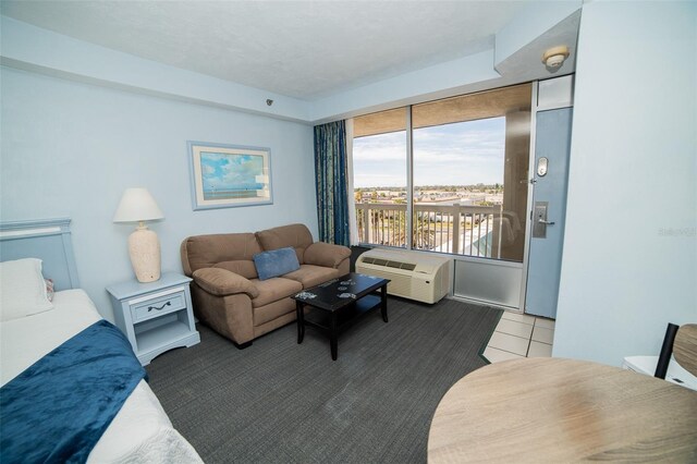 2700 N Atlantic Ave Unit 517, Daytona Beach, FL 32118 - carpeted living area featuring an AC wall unit