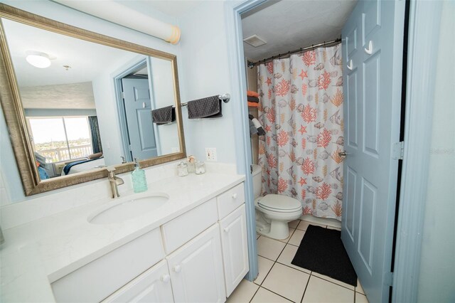 2700 N Atlantic Ave Unit 517, Daytona Beach, FL 32118 - full bath featuring vanity, tile patterned flooring, and curtained shower