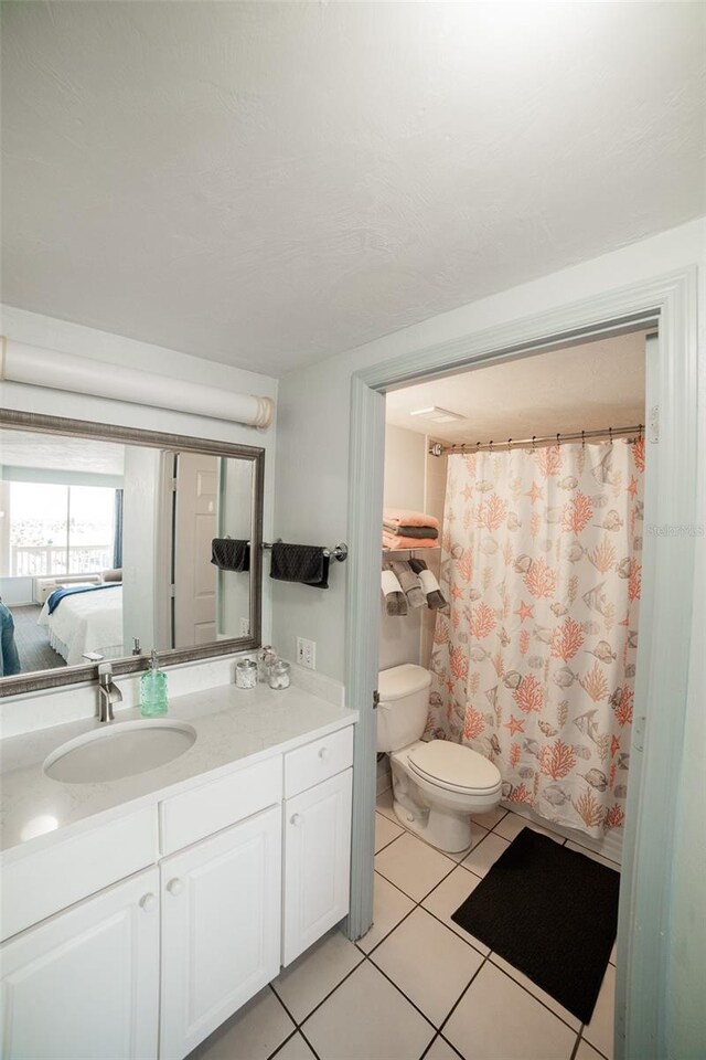 2700 N Atlantic Ave Unit 517, Daytona Beach, FL 32118 - ensuite bathroom with vanity and tile patterned flooring