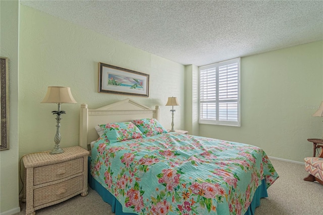 carpeted bedroom with a textured ceiling