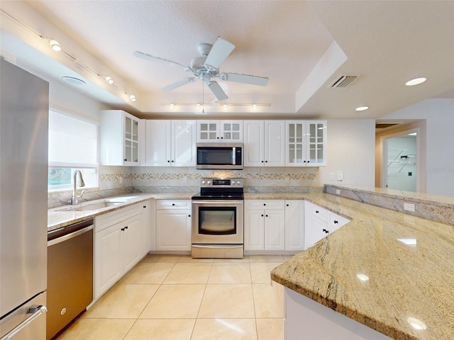 5300 S Atlantic Ave Unit 9201, New Smyrna Beach, FL 32169 - kitchen featuring white cabinets, ceiling fan, and stainless steel appliances