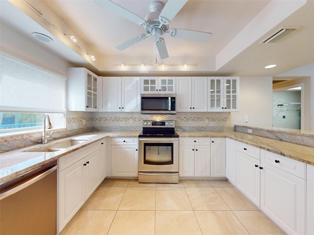 5300 S Atlantic Ave Unit 9201, New Smyrna Beach, FL 32169 - kitchen featuring white cabinets, appliances with stainless steel finishes, and sink