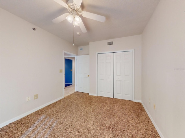 5300 S Atlantic Ave Unit 9201, New Smyrna Beach, FL 32169 - unfurnished bedroom featuring light colored carpet, a closet, and ceiling fan