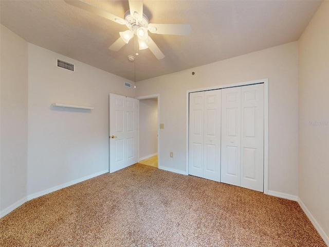 5300 S Atlantic Ave Unit 9201, New Smyrna Beach, FL 32169 - unfurnished bedroom featuring light colored carpet, a closet, and ceiling fan