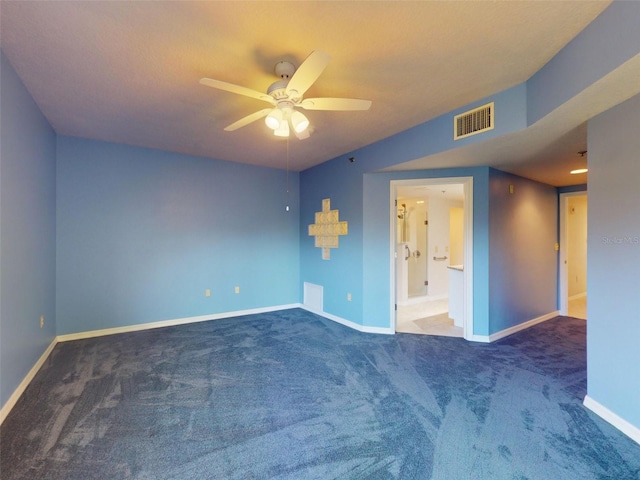 5300 S Atlantic Ave Unit 9201, New Smyrna Beach, FL 32169 - unfurnished room featuring dark colored carpet and ceiling fan